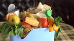 Assorted food waste in a blue bin.