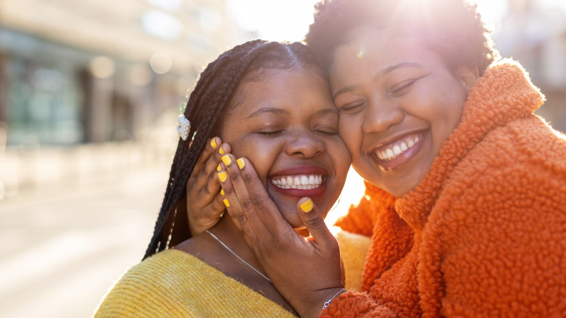 Two people having a cuddle and smiling