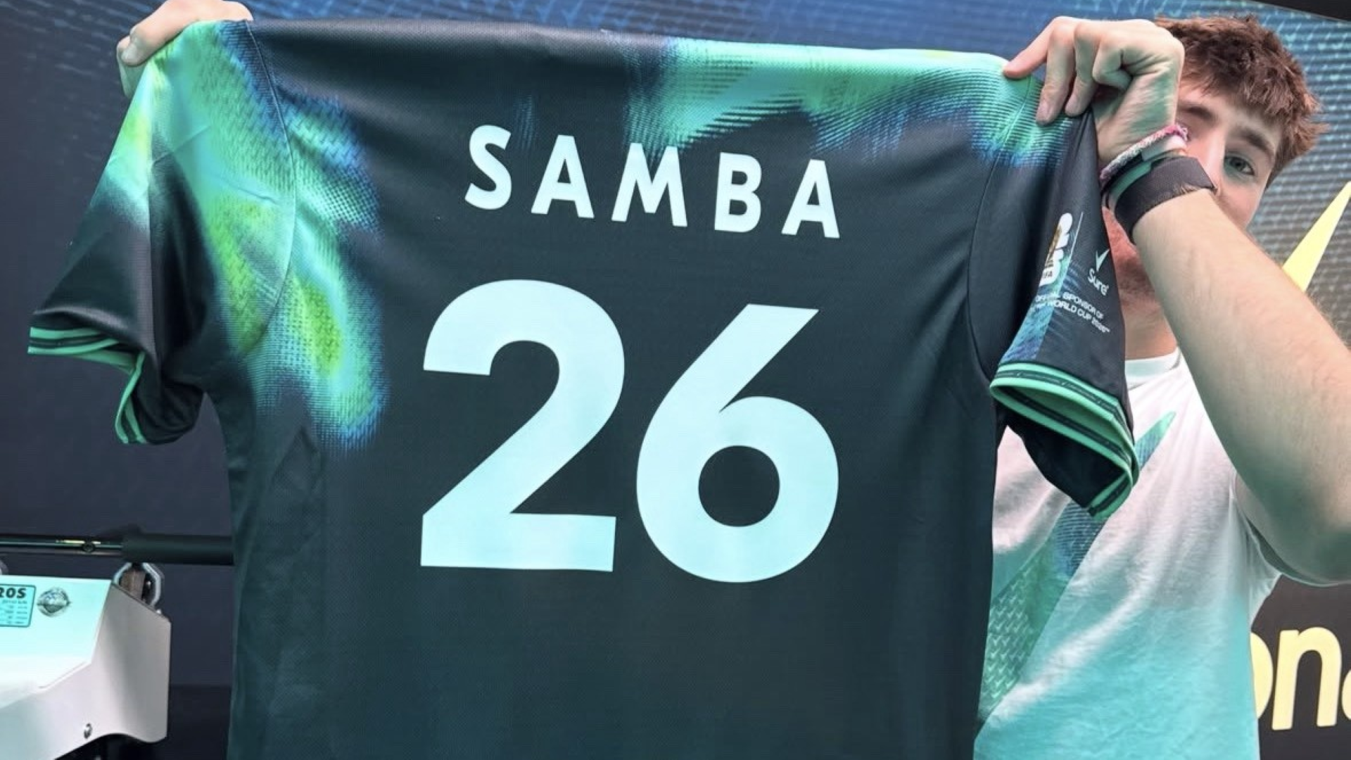 A creator holding up Elfried Samba’s personalised shirt, one of the key activations at Unilever’s House of Fresh ™ hub.