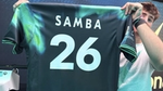 A creator holding up Elfried Samba’s personalised shirt, one of the key activations at Unilever’s House of Fresh ™ hub.