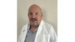 A photo of a scientist who worked on the Vaseline Verified campaign. A white man with short hair and a beard.