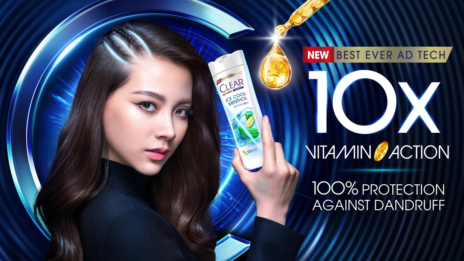 A woman holds a bottle of Clear anti- dandruff shampoo. The niacinamide shampoo helps to give 100% protection against dandruff