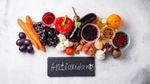 Various food items above a chalkboard on which is written "Antioxidants".