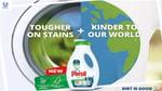 A bottle of Persil in front of a washing machine